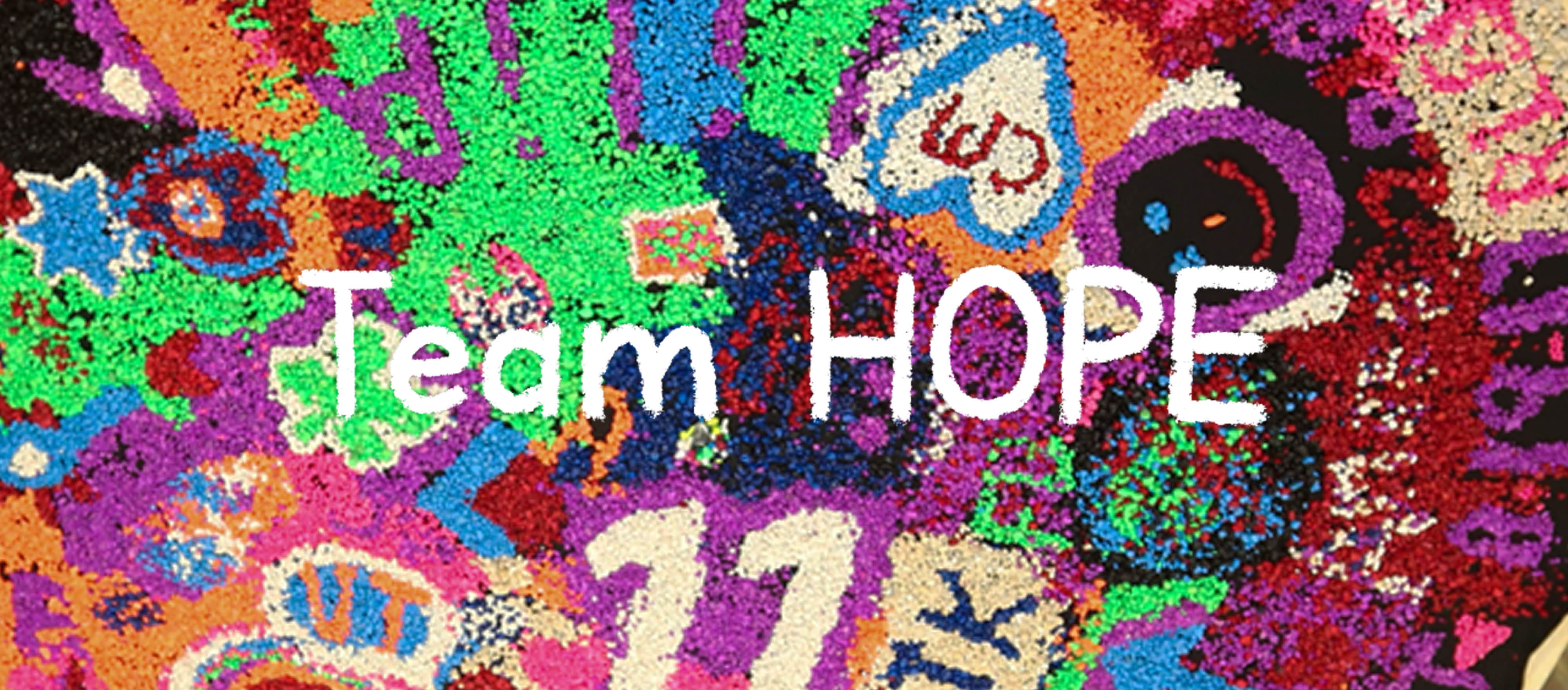 Team HOPE spelled in sand